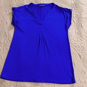 Blue Shirt With Buttons Going Down Back Of Shirt